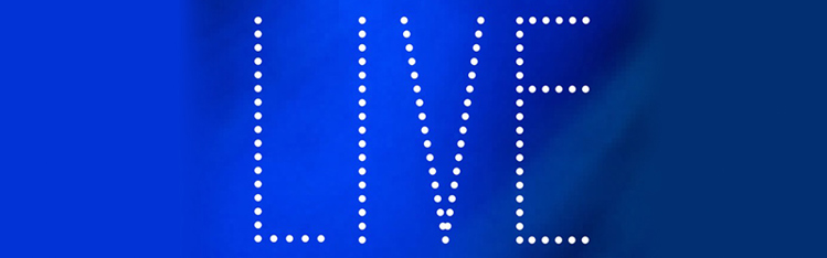 Ordet "LIVE" skrevet med lysende kugler. Hvid på blå baggrund
